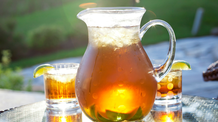 cannabis infused iced tea glasses next to a full pitcher